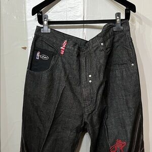 Unk Charcoal Relaxed Fit basketball Miami Heat Jeans with Red Accents.